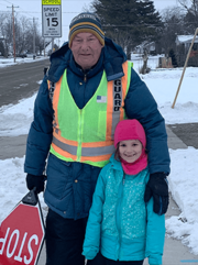 Crossing guard with student