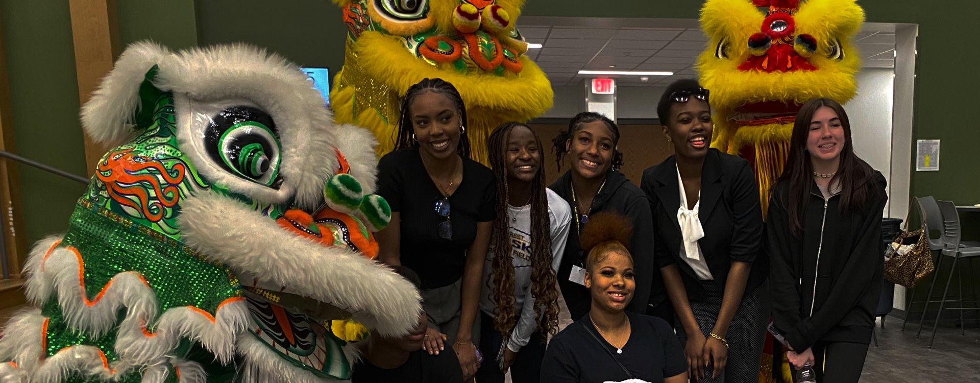 students with decorative dragons at multicultural event