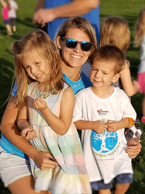 Mom and kids smiling