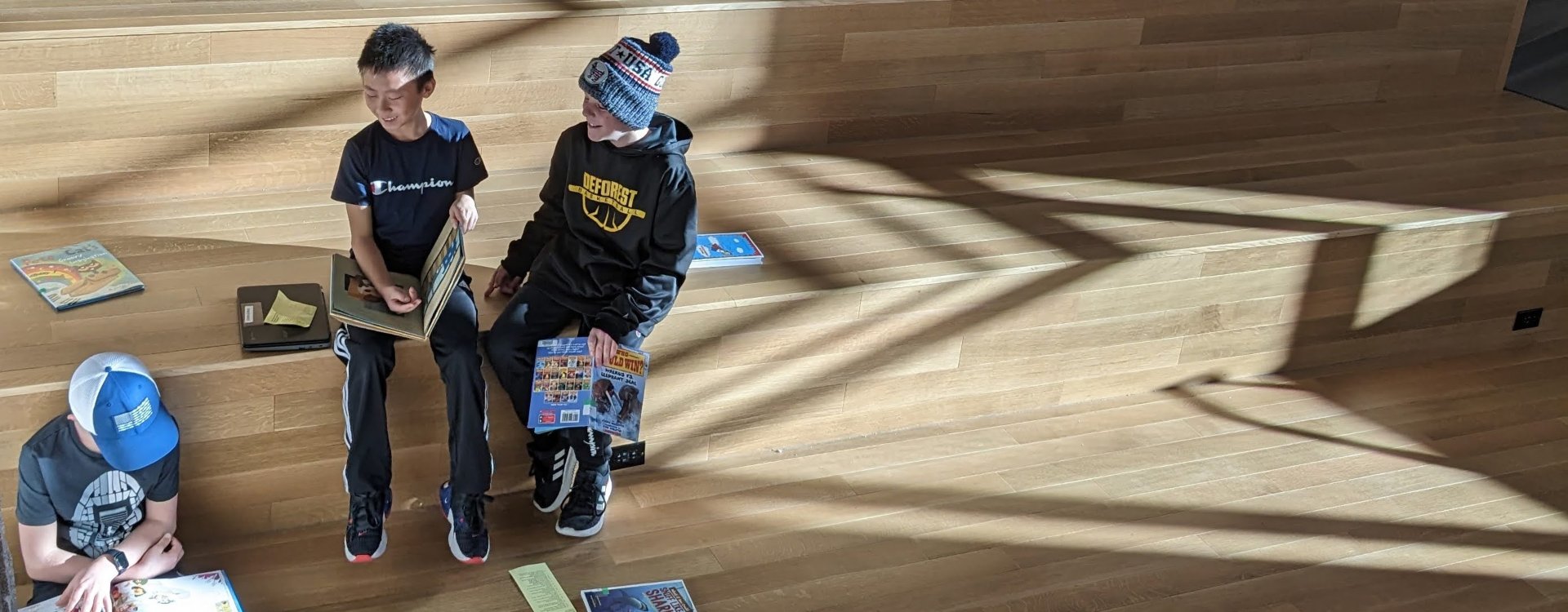 students with books on social stairs