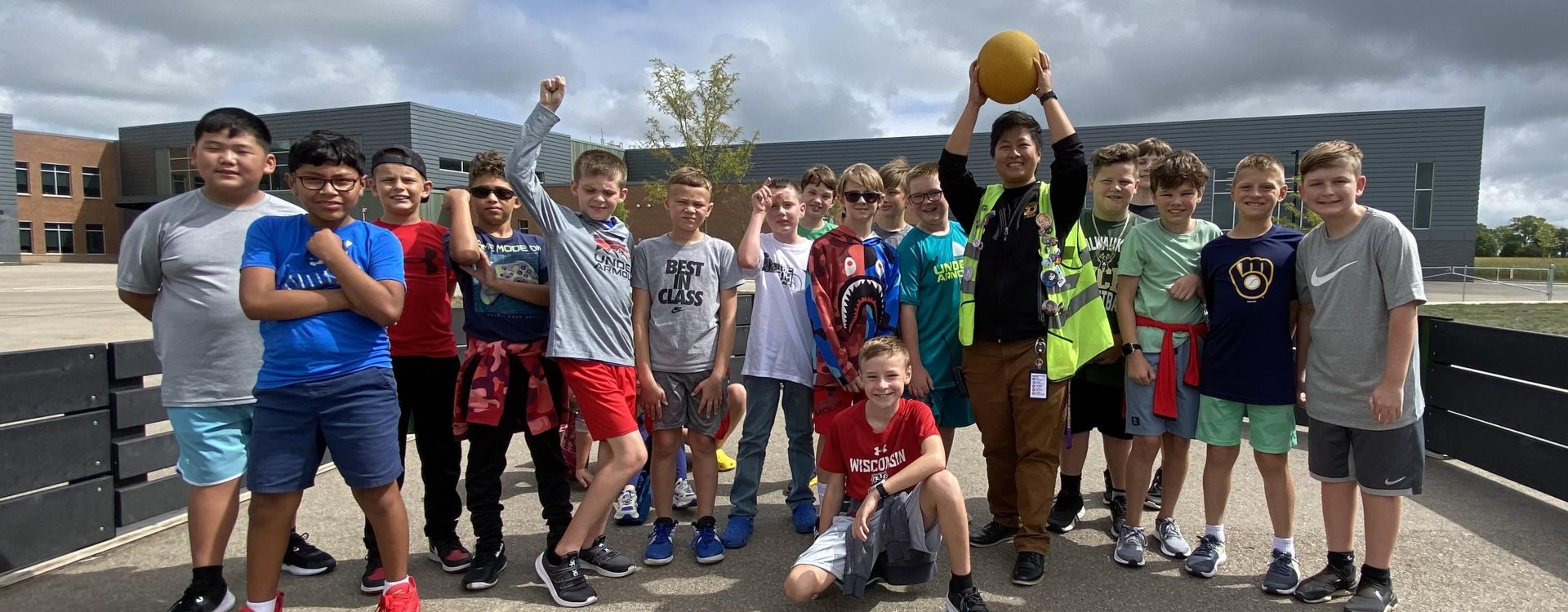 students with staff outside