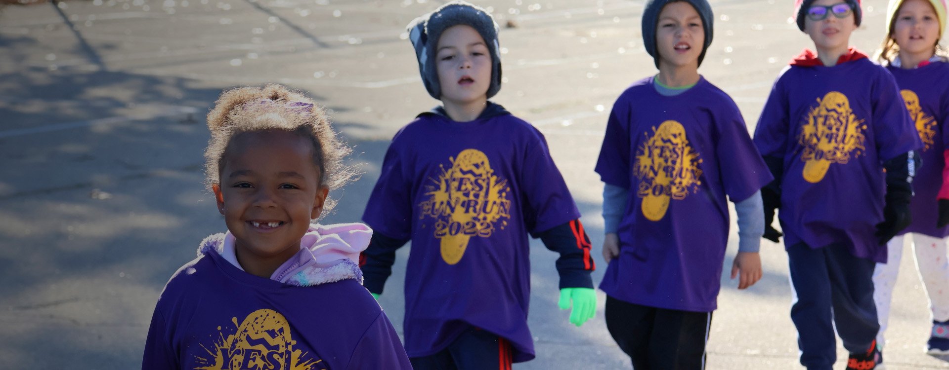 students in matching tshirts for school fun run